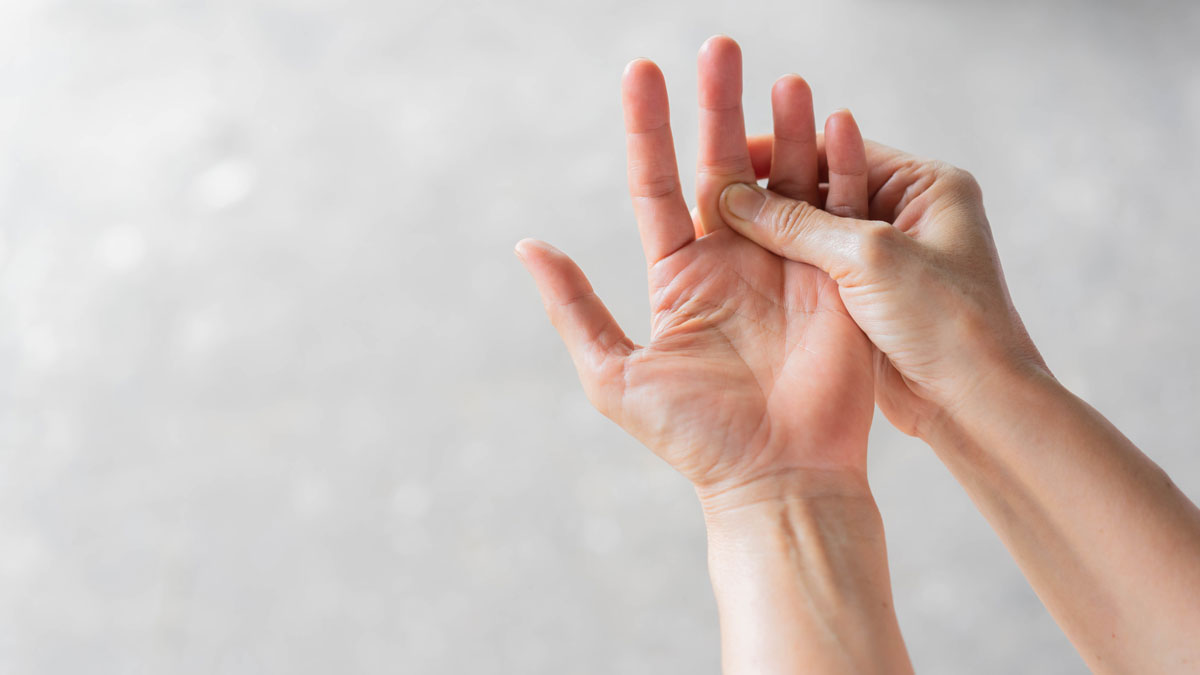 one hand massaging other hand