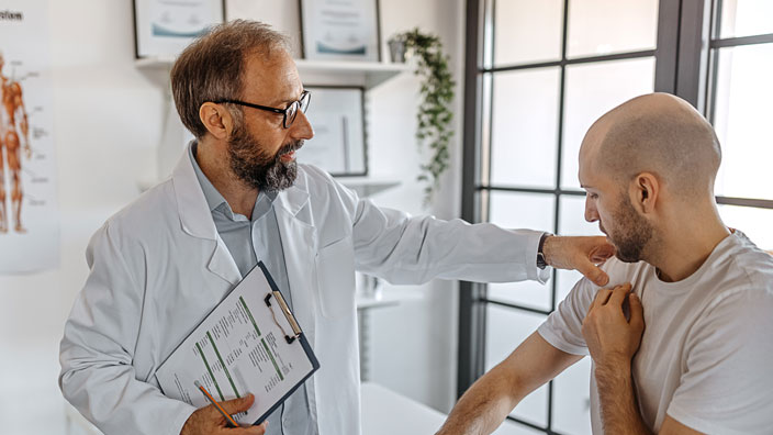 medical professional speaking to patient