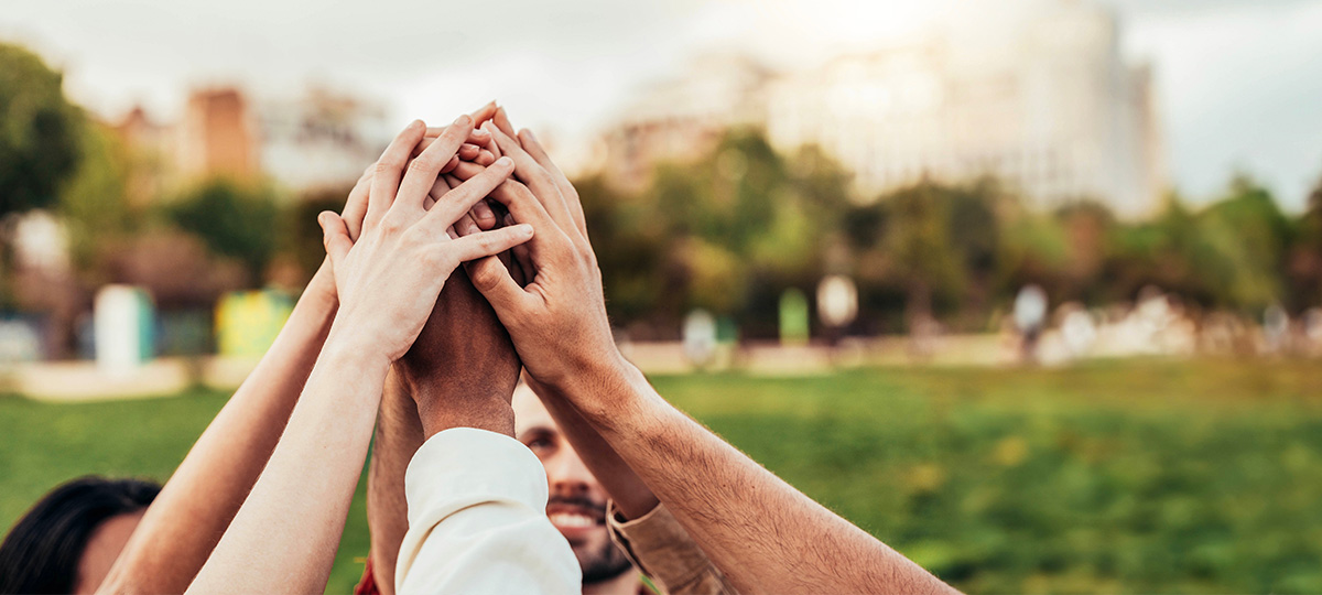 An image of a hands held together in unity.