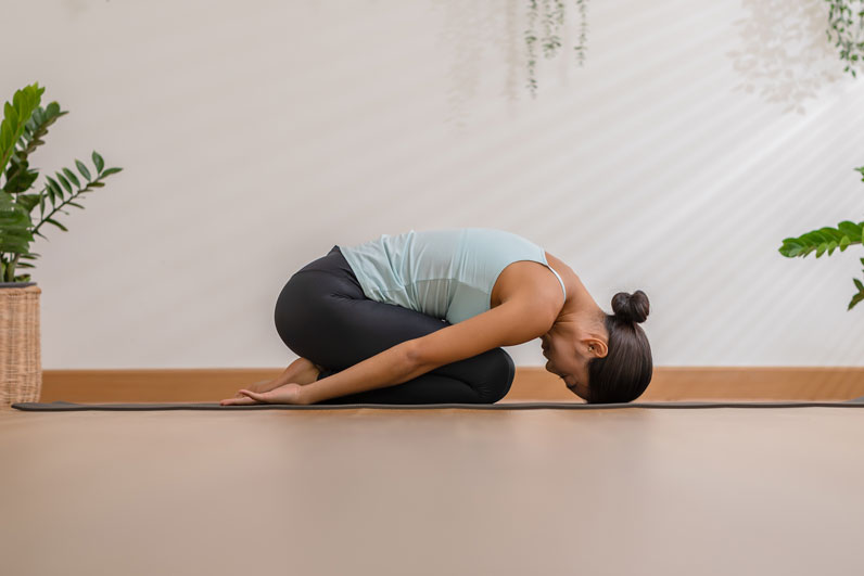yoga-woman-child-pose.jpg