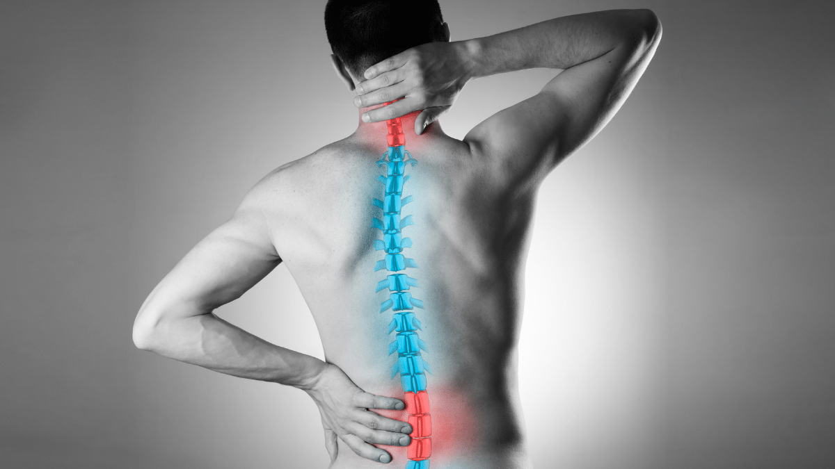 An image of someone stretching their back in pain, the image shows their spine.