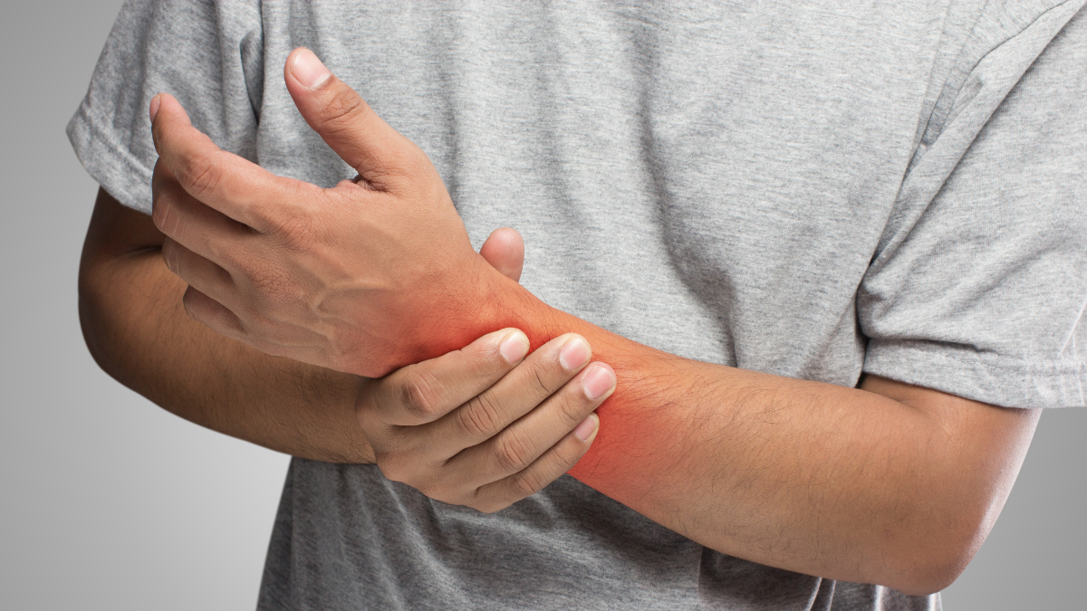 An image of a man's arm, part of it is highlighted red to show that it is in pain.