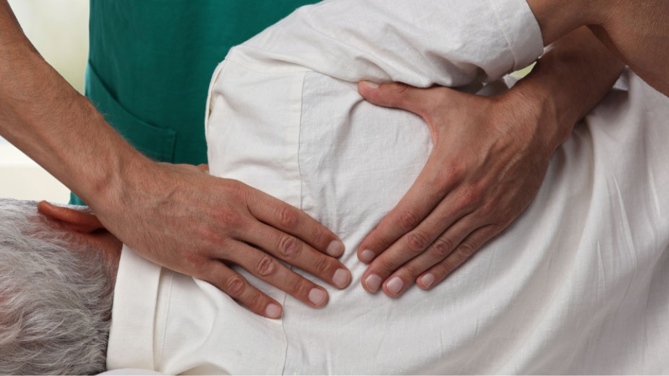 older male client receiving structural integration massage therapy