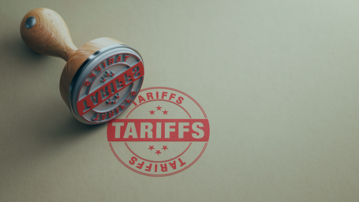An image of a stamp that says "Tariffs" in red ink in a circle.